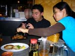Margaret_helping_Khoi_take_food_pix